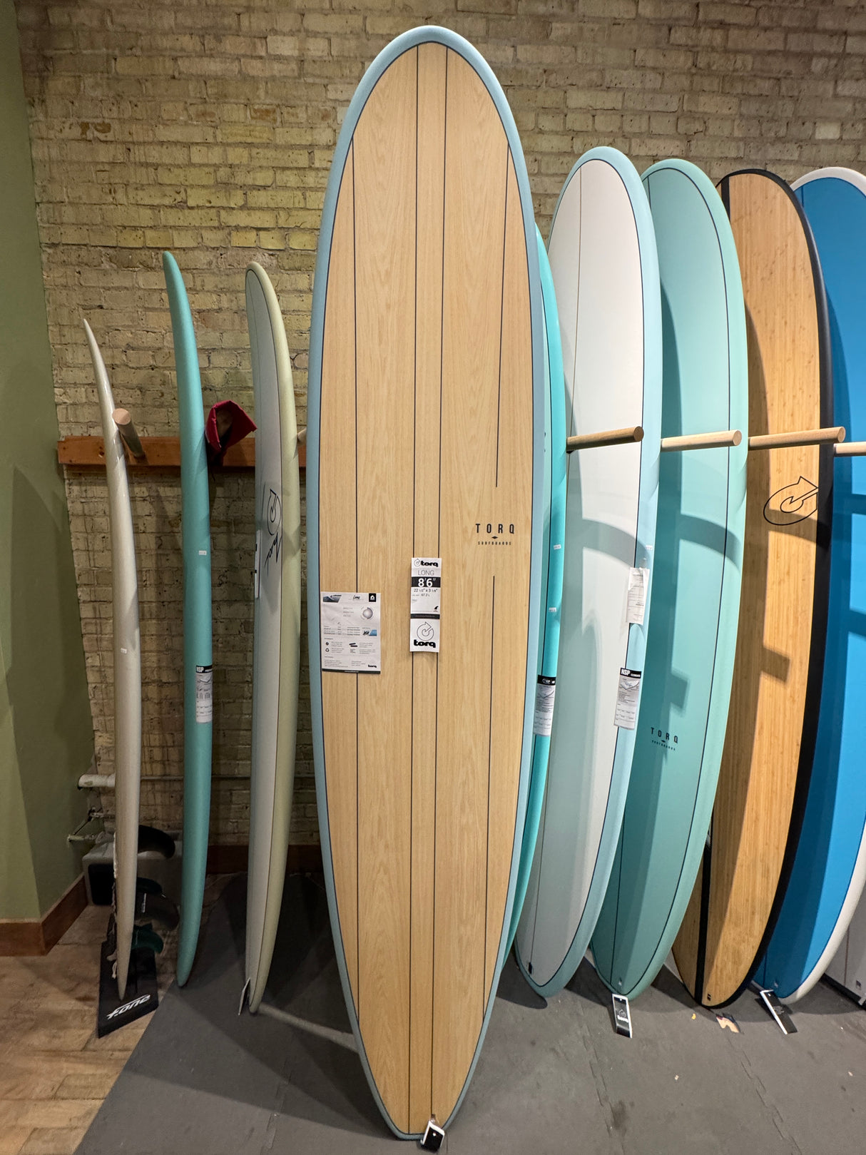 Torq "Long" Surfboard 8'6" Wood Grain with Light Blue Rails