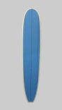 A blue surfboard with a white border, standing vertically against a light brown wooden plank wall.